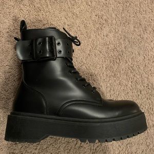 Black lace up boots.